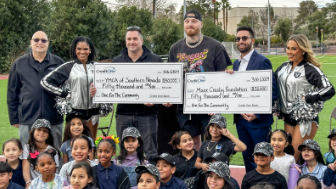 Raiders Defensive End Maxx Crosby and representatives from Credit One Bank present donations of $50,000 to two local nonprofits, YMCA of Southern Nevada and Maxx Crosby Foundation.